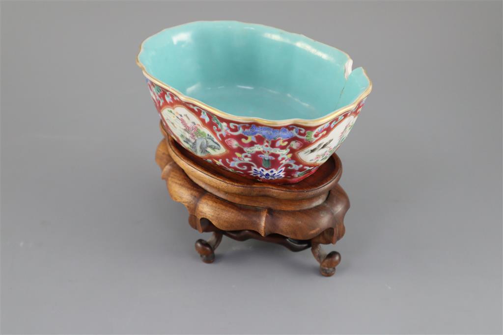 A Chinese ruby ground jardiniere, Daoguang mark and of the period (1821-50), 17cm wide, 6.5cm high, wood stand